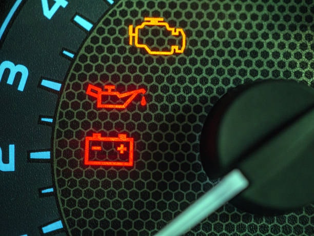 Dashboard warning lights — engine, oil pressure and battery indicators illuminated